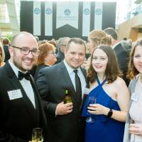 Guests posing with their drinks in the Grand Gallery